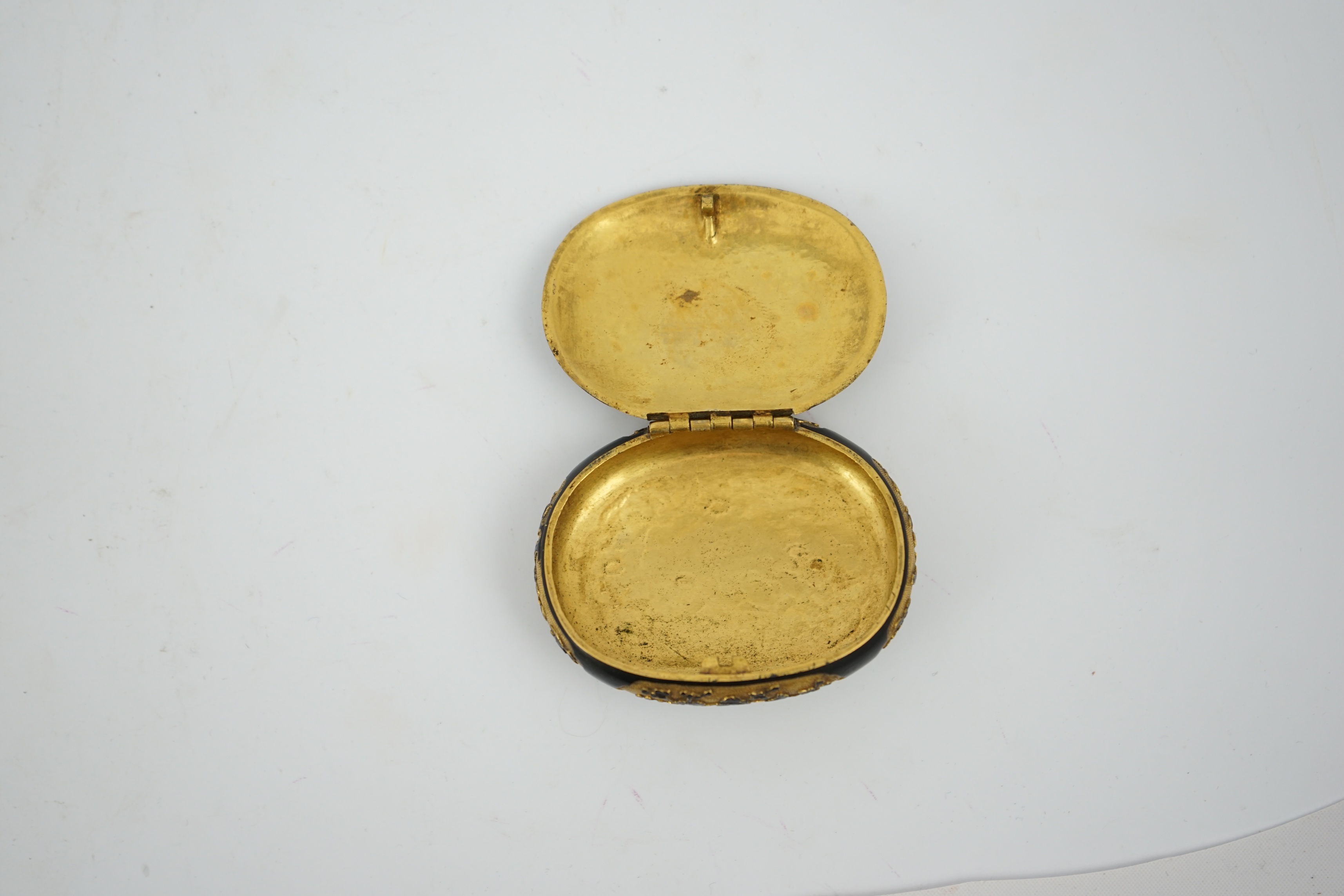 A small Japanese export gilt bronze Sawasa oval tobacco box, 18th century